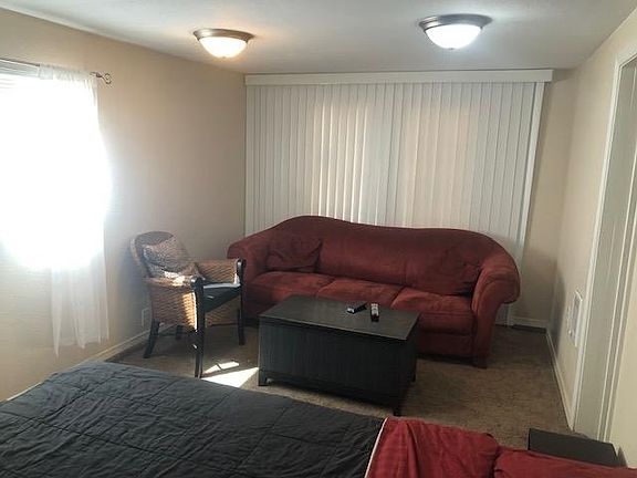 Couch, chair, coffee table/trunk for storage.