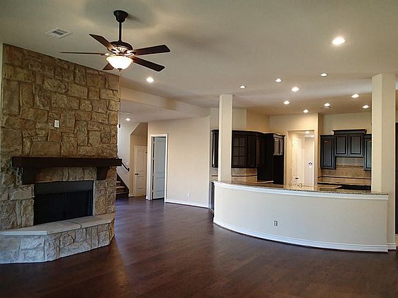 Stone fireplace w/ cedar mantle.
