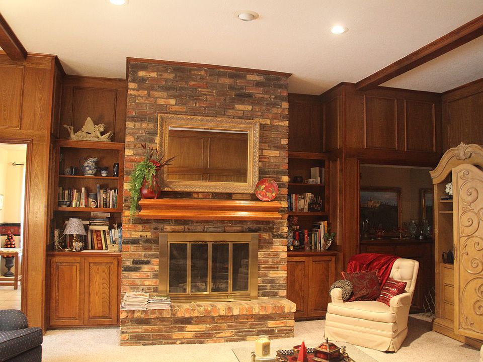 brick fireplace with gas logs