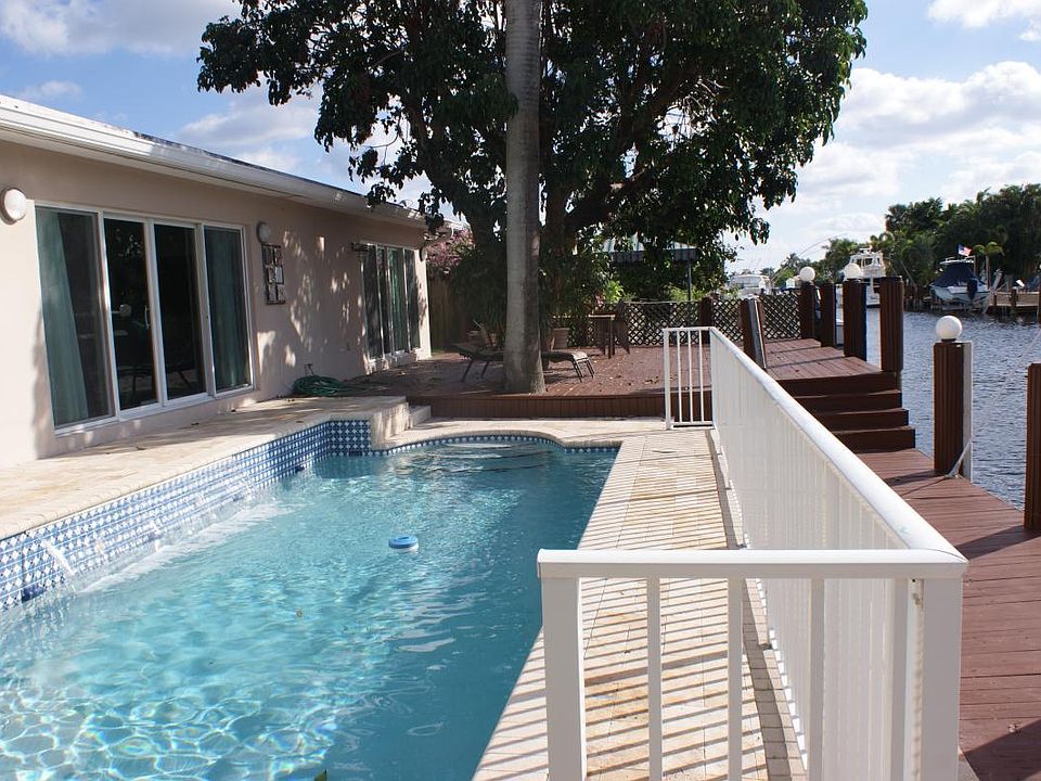 waterfront pool with waterfall