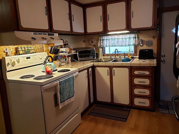 Kitchen has lots of cabinets