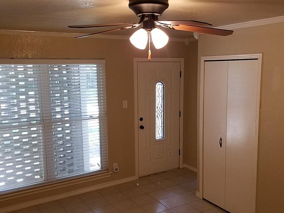 Living room towards front door and picture window