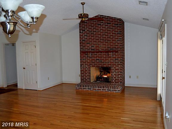 Living room fireplace has gas logs