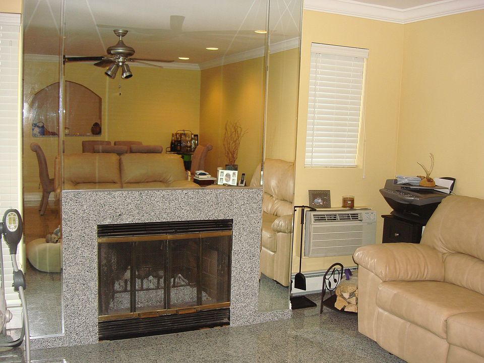 Living Room - Mirrored/Granite Fireplace