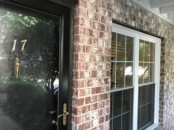 Photo from the courtyard of the door and living room window