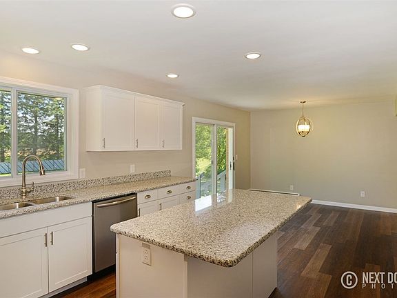 The large island features bar seating.