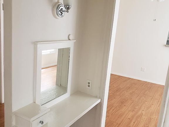 Bonus vanity desk and mirror in hallway.