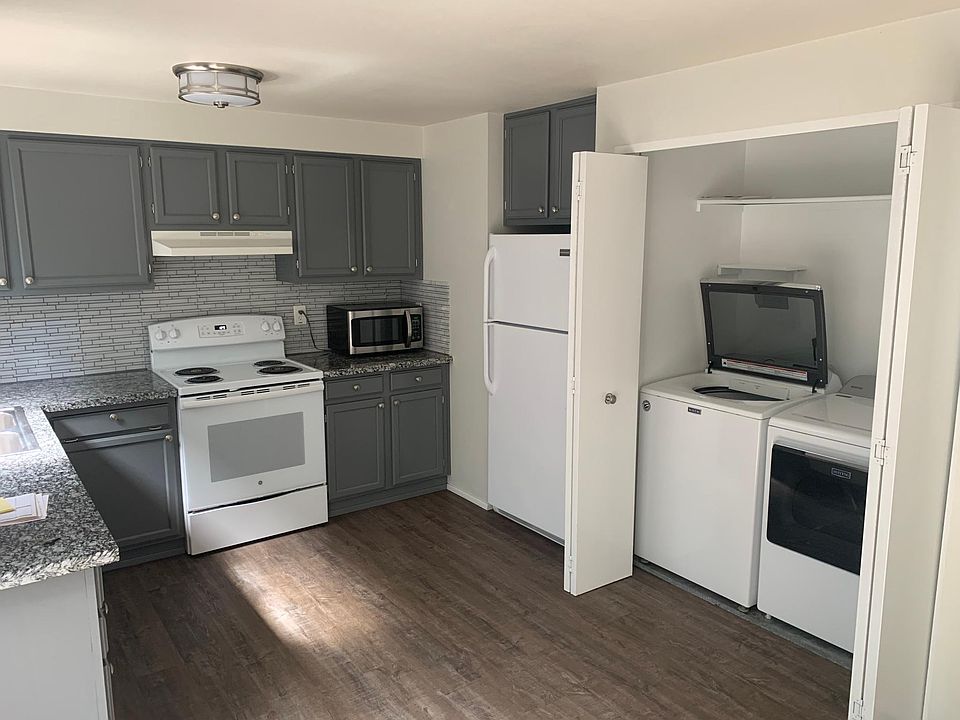 Kitchen with laundry closet.