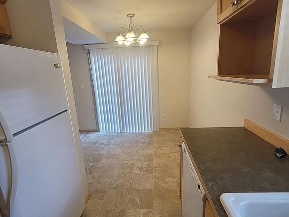 kitchen to dining with slider to small yard