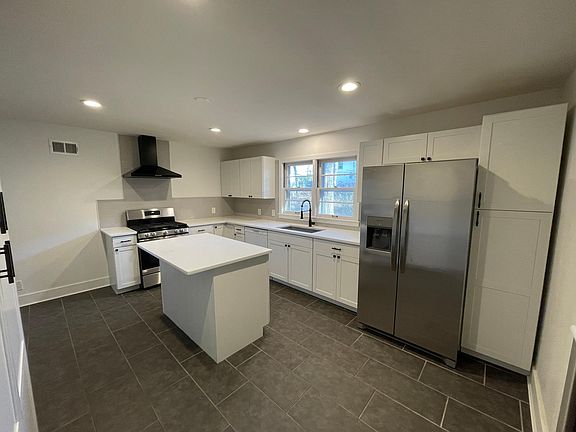 Kitchen (Includes gas stove, refrigerator, dish washer and laundry washer and dryer)