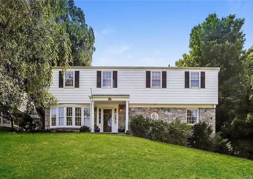 Welcome to 6 Windsor Lane ~ 5 Bedrooms, 3 Full Baths~ Classic Colonial with first floor bedroom/office and bath and a captivating Sunroom and large patio