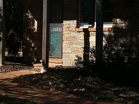 Entry to apartment; genuine fieldstone exterior.