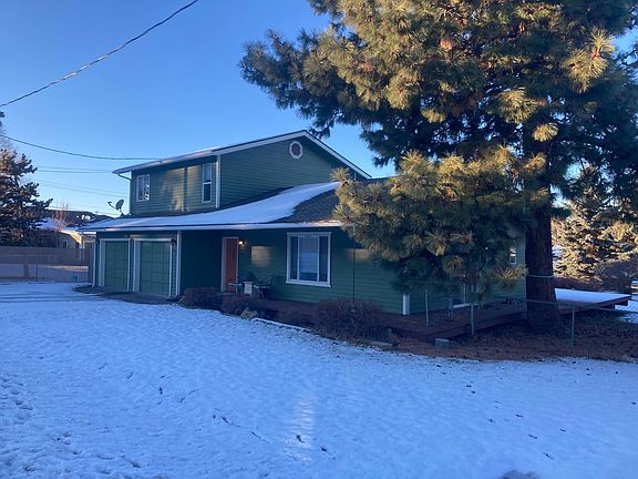 Front of house from Powers Dr. Large tree to be limbed up before the move-in date.