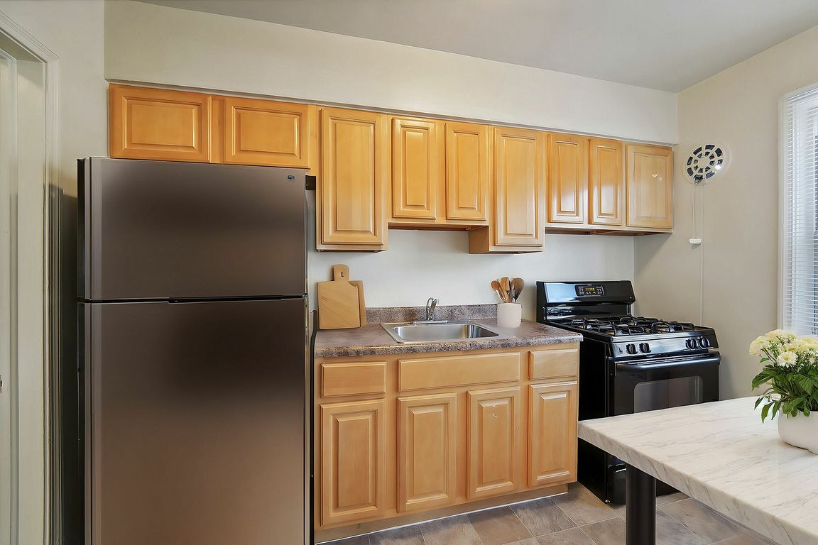 Explore this elegantly designed kitchen featuring premium finishes and ample storage.