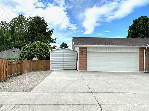 One car covered carport aside of the 2 car garage