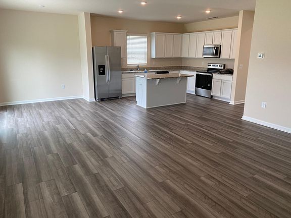 specious living room with kitchen.