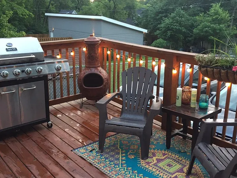 Large back deck with chimenea and string lights