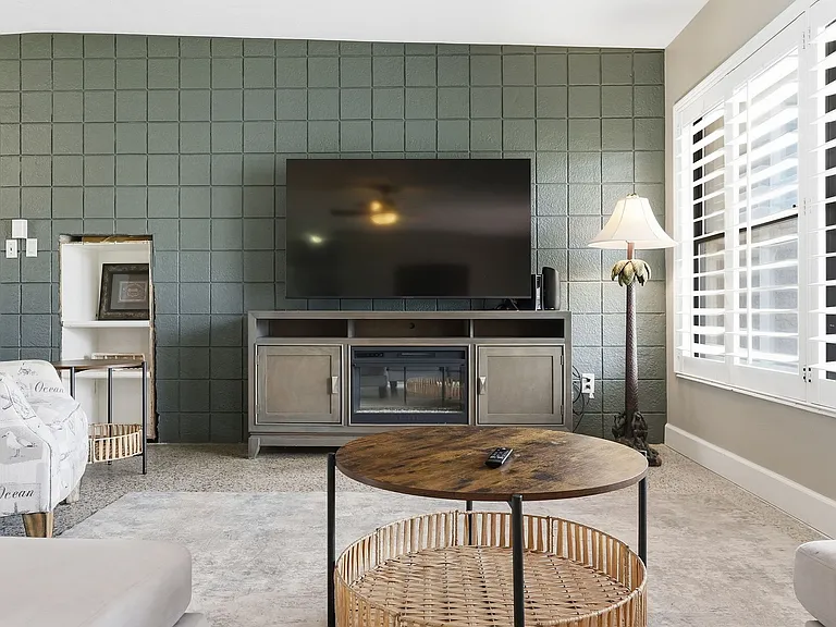 65 inch TV in living area.