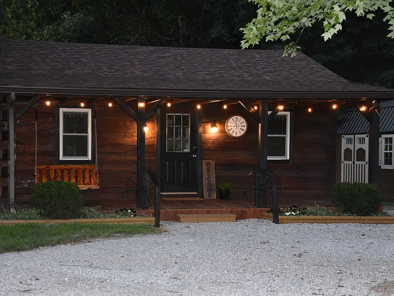 Large front deck with a swing and chairs!