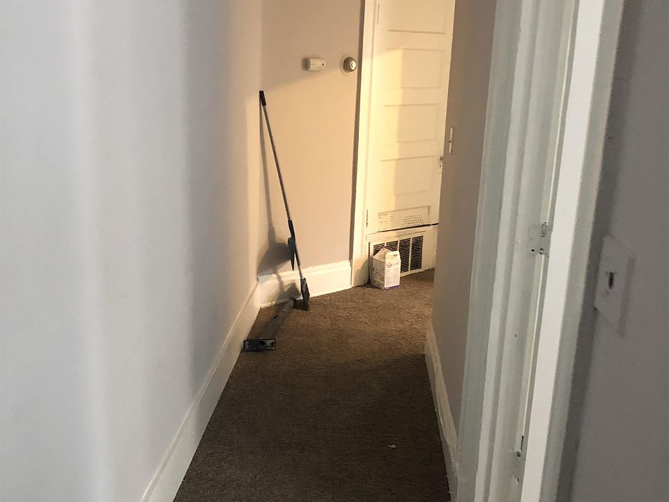 Hallway from Living Room to 1st bedroom on the right and then bath around the corner