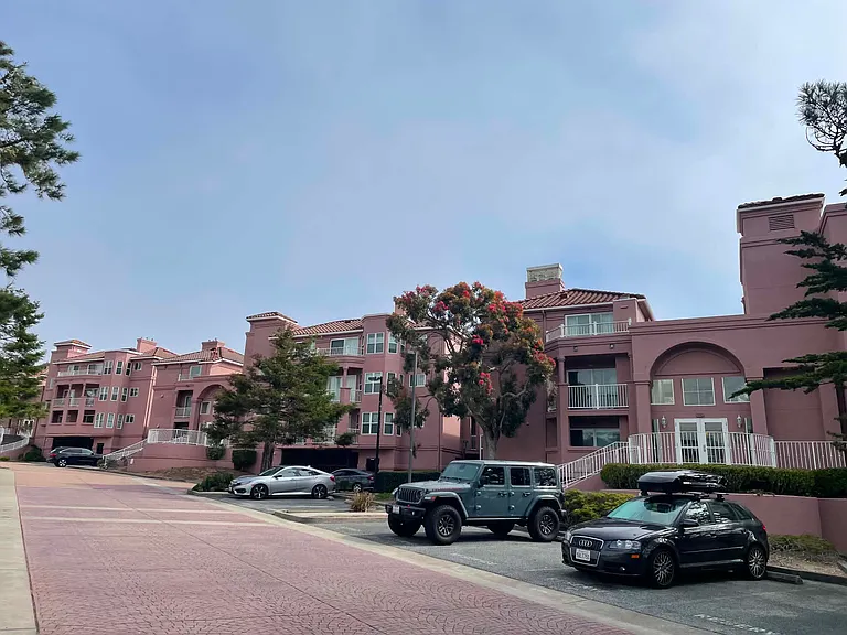 Building exterior. Lot of visitor parking.