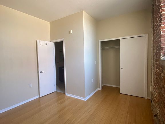 Bedroom showing closet and bath entrance