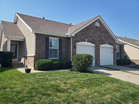 Exterior front entrance with attached garage
