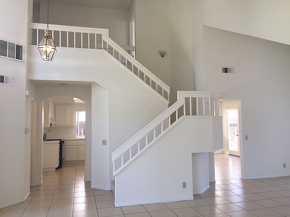 View of stairs from double door entry