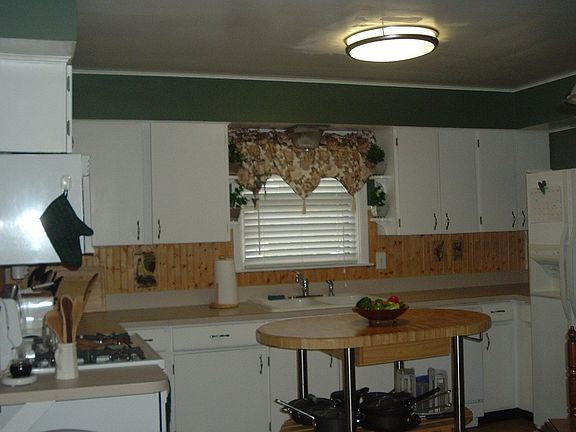 Kitchen with center isle and ceramic floors