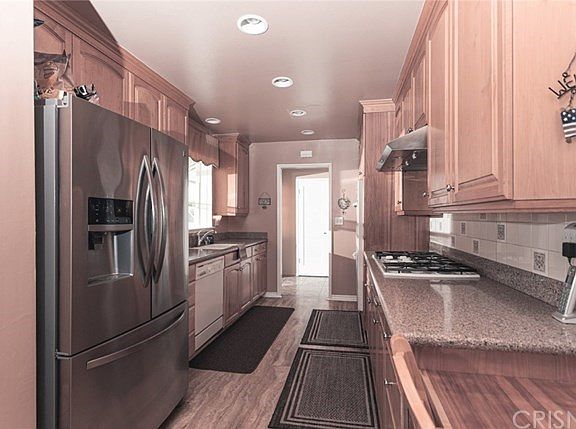 Remodeled Kitchen features natural Maple Cabinetry