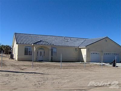 Front of home. Poles for chainlink are already in.