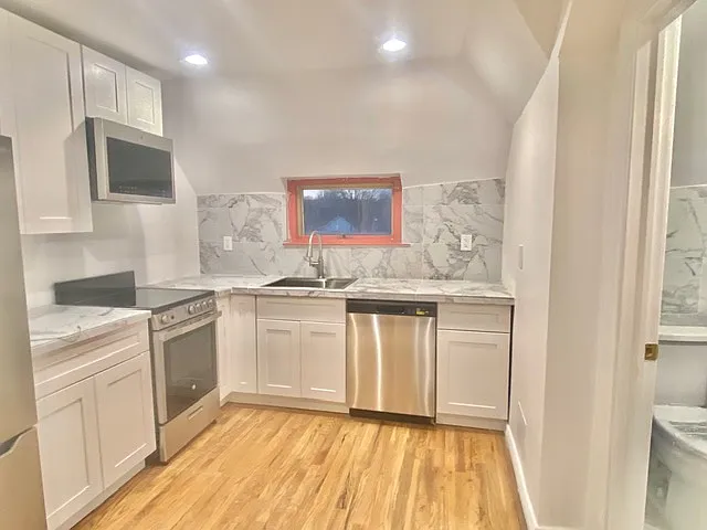 Kitchen another view. (The window frame is white (no longer red)
