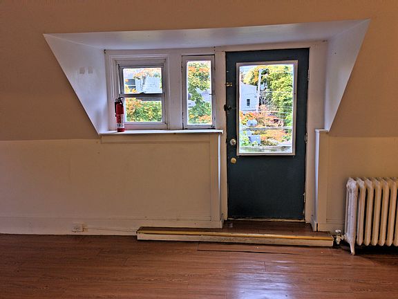 Living room looking to fire escape door