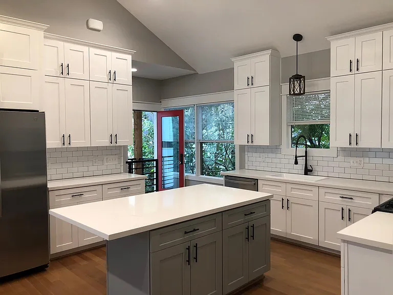 Large kitchen with exceptional storage showing front entrance and balcony access