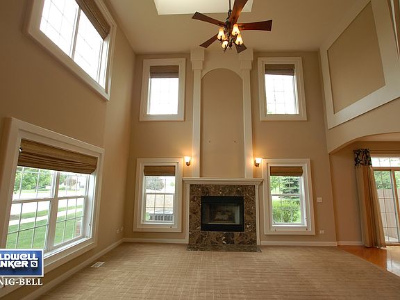 Dramatic Two Story Family Room with Skylights
