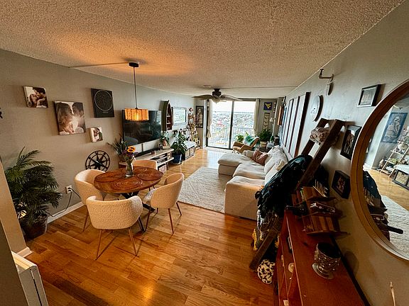 Main living room, standing at the edge of the foyer hallway