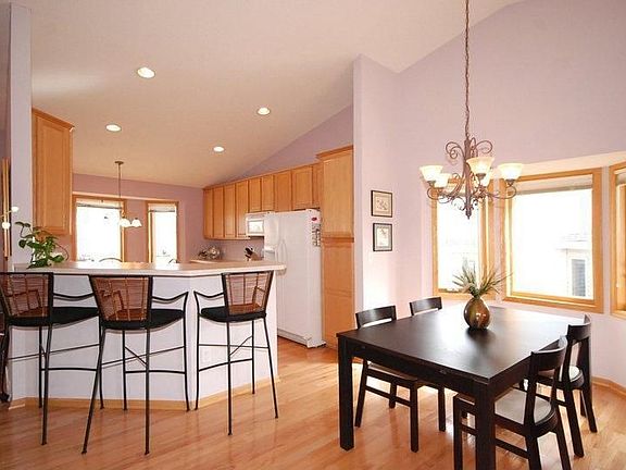 Formal dining area is vaulted with a bayed window.