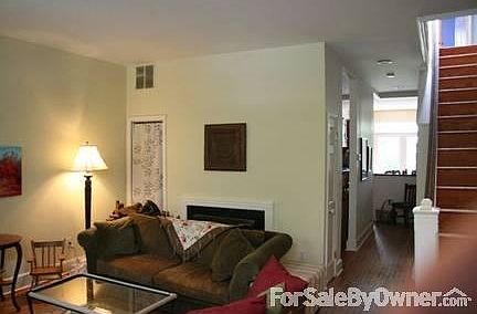 Living room
						:
						Spacious living room with a wood-burning fireplace.