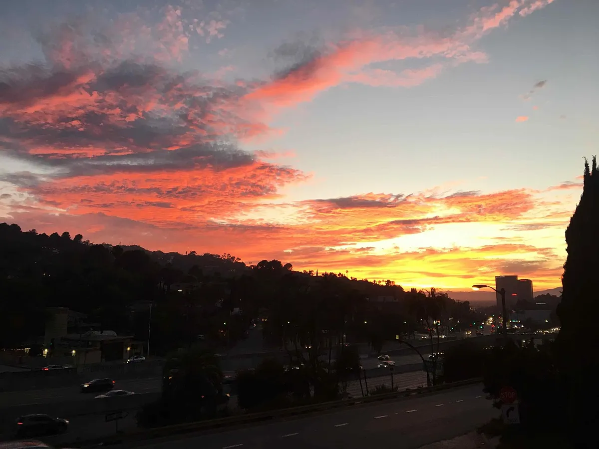 Sunset view from balconies off living room and master bedroom. - 3033 Hollycrest Dr