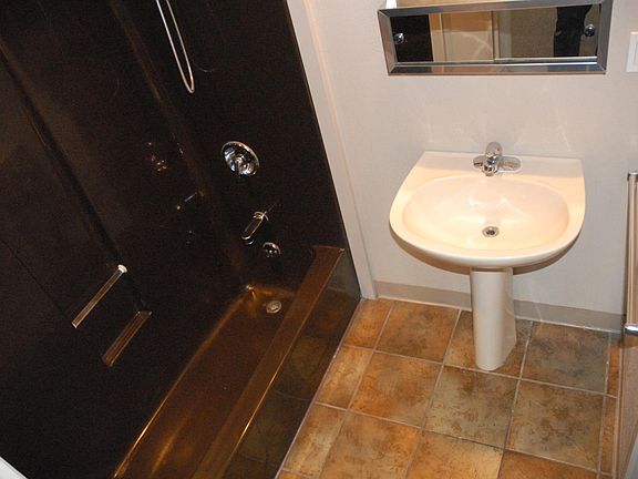 Bathroom with tub and shower