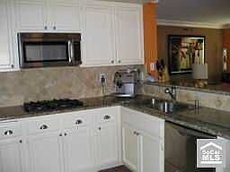 Gourmet kitchen w/slab granite, stainless steel, dbl ovens & dbl dishwasher