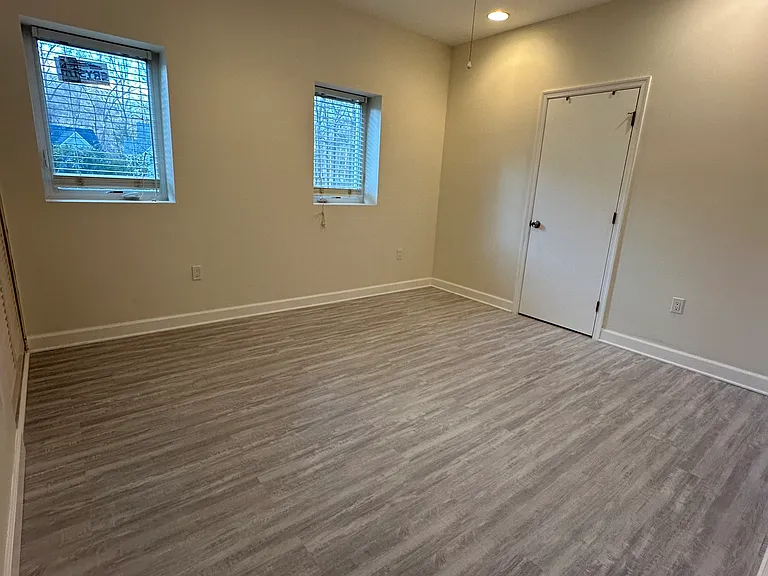 Bedroom #2 with an ensuite bathroom inside. Door showing here is the bathroom door.