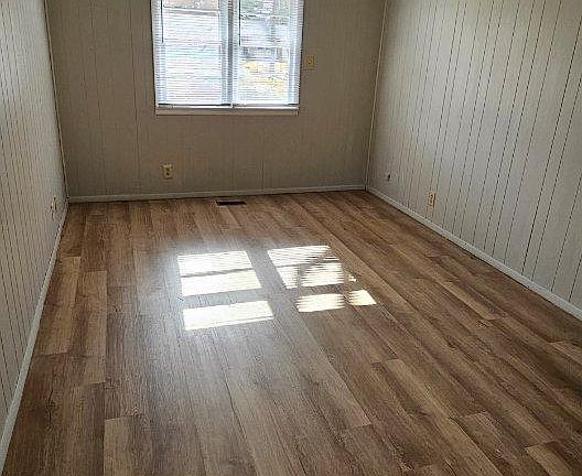 4th bedroom with new vinyl plank flooring. Bathroom connected.