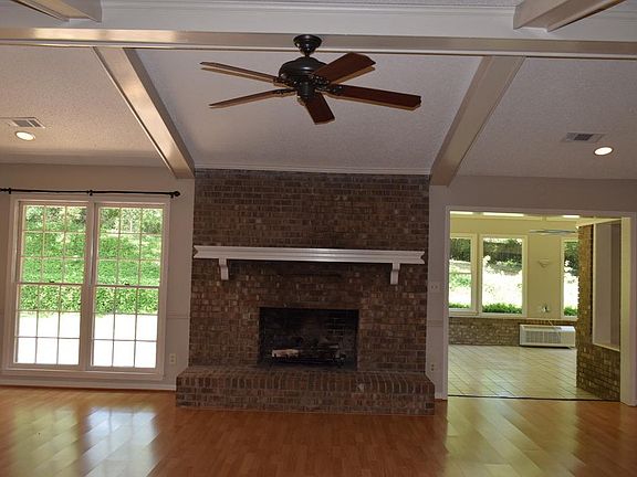 Large Den with fireplace, fan and windows--opens into sunroom........Beams with vaulted ceiling
 Huge Room with Fireplace & windows that look out onto patio