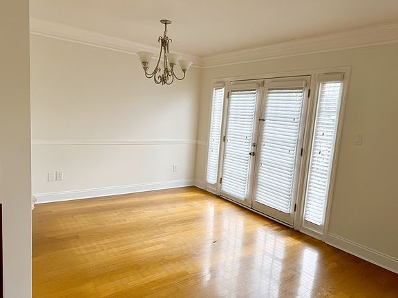 Dining. This french door leads you to the patio that extends through the unit with clubhouse and pool view.