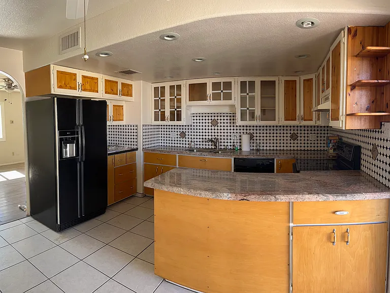 Eat-In Kitchen, granite counter tops with sliding door to covered porch