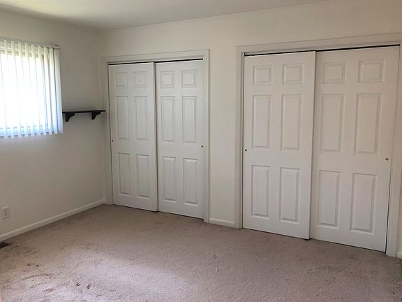 Rear bedroom with lots of closet space. New carpet September 2025.