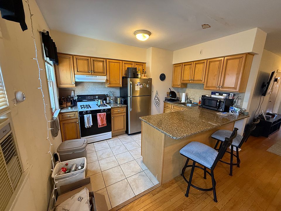 Large kitchen, breakfast counter seating, new stove will be installed