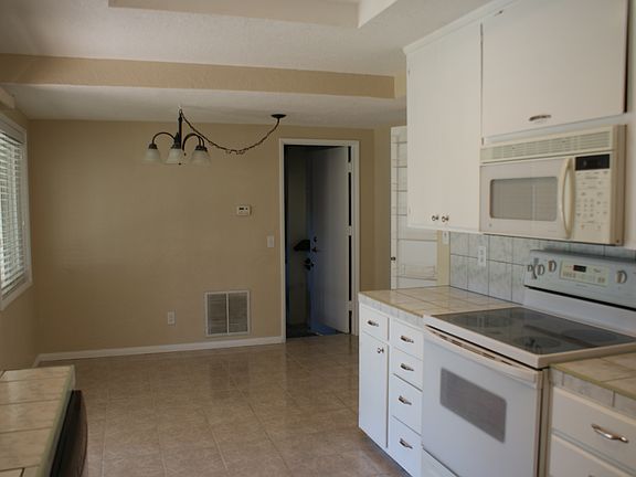 Eating area and door to attached 2 car garage with laundry h