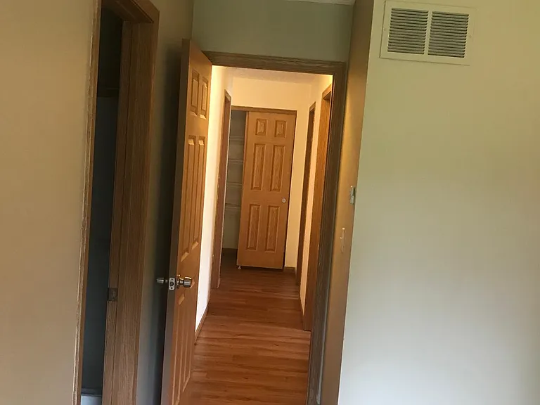 view from master bedroom to rest of bedrooms and linen closet